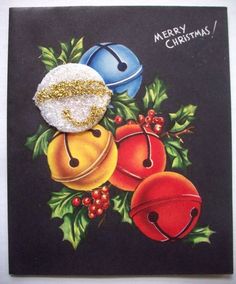 a christmas card with three bells and holly on the front, one bell has been decorated