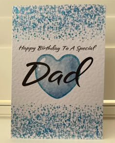 a happy birthday to a special dad with blue sprinkles on the card