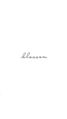 a black and white photo with the word blossom written in cursive writing on it