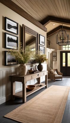 a room with a rug, mirror and vases on the wall