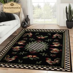 a black area rug with red and green flowers on it