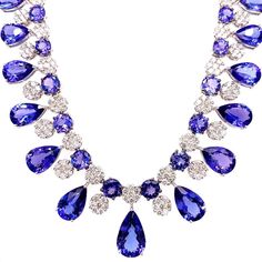 For Sale on 1stDibs - Majestic tanzanite diamond necklace earrings set. High lustre, transparent clean, violet-bluish, purple, pear, round faceted, 66.36 carats natural tanzanites Cascade Necklace, Bluish Purple, Tanzanite Pendant, White Gold Pendant Necklace, Tanzanite Necklace, Tanzanite Diamond