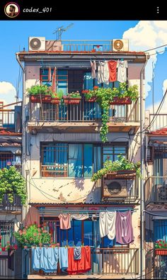 an apartment building with balconys and plants on the balconies in front of it