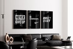 three black and white posters on the wall in a living room