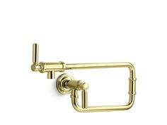 a gold toilet paper holder on a white background with the handle extended to it's left side