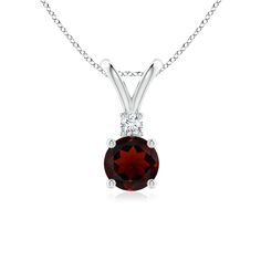 Featuring an alluring round garnet, this solitaire pendant with V bale evokes sophisticated charm. A prong set diamond sits above the garnet and enhances its deep red hue. This garnet diamond pendant is sculpted in 14k white gold. Necklace With Diamond, Solitaire Pendant Necklace, Garnet Pendant, Solitaire Pendant, Fine Jewellery Necklace, Deep Red, Diamond Pendant, Prong Setting, Garnet