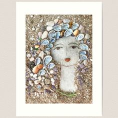 an art print with shells and a woman's face