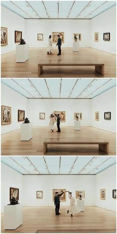 two people are dancing in an art gallery