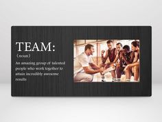 a group of people standing around each other in front of a black frame with the words team on it