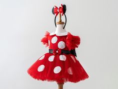 ✨ Introducing the Enchanting Red Tutu Dress for Toddlers & Babies! ✨ Calling all loving mothers who want the best for their precious ones! Step into a world of magic with our stunning tutu dress. Perfect for birthdays, Halloween, festivals, trips, and everyday dress-up, this dress promises unforgettable moments and turns heads wherever your child goes. Our Dress combines cotton and sequin fabric for a stunning appearance that's both playful and comfortable. With an elastic waist and adjustable straps, it ensures a snug and flexible fit for your little one as she grows. 🎀 Handmade Magic: Every detail is carefully crafted with love. From the delicate ears (optional, available at extra cost) to the charming bows and playful polka dots, our dress sparks imagination and brings the joy of to li Playful Dresses For Holiday Parties, Fitted Christmas Tutu Dress For Fancy Dress, Fitted Tutu Dress For Christmas Fancy Dress, Red Dresses For Carnival Costume Party, Red Fitted Princess Dress For Birthday, Fitted Red Princess Dress For Birthday, Red Minnie Mouse Party Dress, Playful Red Party Dress, Fitted Red Princess Dress For Fancy Dress