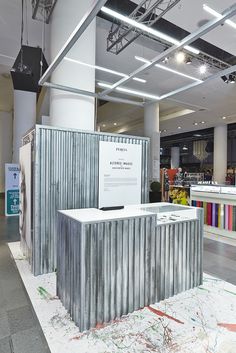 an exhibit booth in a building with metal walls