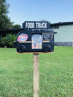 a food truck sign in front of a building with the words food truck written on it