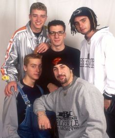 four young men posing for a photo together