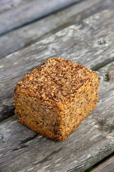 a piece of bread sitting on top of a wooden table