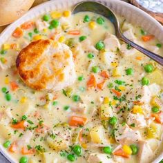 a bowl of chicken pot pie soup with a ladle and potatoes on the side