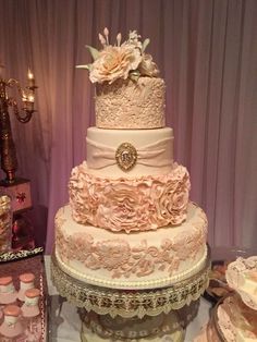 a wedding cake is displayed on a table