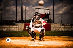 a baseball player holding a catchers mitt in front of a ball on a field