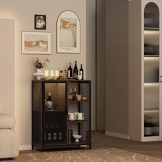 a living room filled with furniture next to a white chair and book shelf on top of a hard wood floor