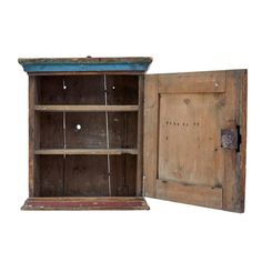 an old wooden cabinet with two open doors