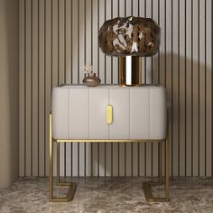 a white and gold cabinet with a lamp on top in a room that has vertical striped walls