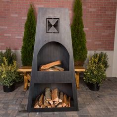 an outdoor fire pit with logs in it