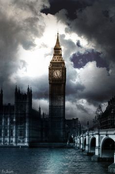 the big ben clock tower towering over the city of london, england under a cloudy sky