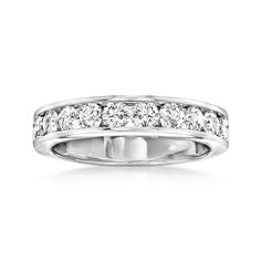 a white gold wedding ring with five diamonds on the side and two rows of round brilliant cut