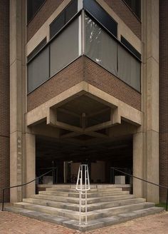 an empty parking garage with stairs leading up to it