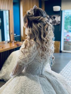 the back of a bride's dress in a salon