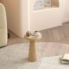 a small table with a book on it in the middle of a living room