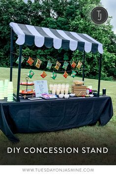 Black and white striped concession stand with popcorn, nachos, chips and candy. Backyard Concession Stand, Outdoor Movie Night Concession Stands, Diy Snack Table Party, Welcome Snacks For Guests, Party Concession Stand Ideas, Baseball Party Concession Stand, Snack Shack Ideas Concession Stands, Outdoor Concession Stand, Concession Stand Birthday Party