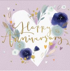 the words happy anniversary are written in gold and blue flowers on a heart shaped card