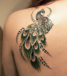 a woman with a peacock tattoo on her back