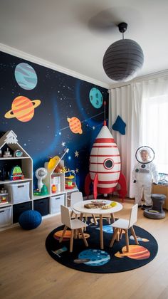 a child's room with space themed wallpaper and toys on the floor in front of it