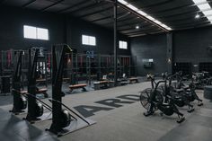 an indoor gym with rows of exercise bikes