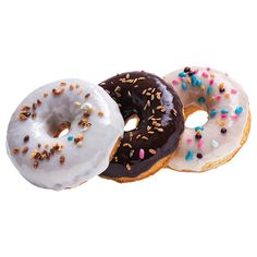 three donuts with white frosting and sprinkles