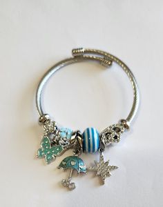 Fashion bracelet. 6.5-7.5 in. New Bangle Bracelets With Charms, Silver Bangle Bracelets, Charm Bangle, Bracelets And Charms, Blue Butterfly, Fashion Bracelets, Fashion Watches, Bangle Bracelets, Umbrella