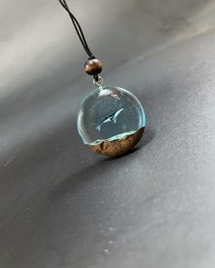 Whale Pendant Necklace - Unique Epoxy Resin Jewelry Dive into the depths of the ocean with our stunning whale pendant necklace! Handcrafted from high-quality epoxy resin, this unique piece captures the beauty of marine life in a vibrant and eye-catching design. Perfect for ocean lovers and nature enthusiasts, each necklace is a one-of-a-kind creation, showcasing intricate details that reflect the grace and majesty of whales. Wear it as a statement piece or gift it to someone special who cherishes the sea. This necklace not only adds a touch of whimsy to any outfit but also serves as a reminder of the importance of marine conservation. Lightweight and comfortable, it's perfect for everyday wear or special occasions. Key Features: Handcrafted with love and care Unique whale design Eco-friend Epoxy Necklace, Whale Pendant, Epoxy Resin Necklace, Epoxy Jewelry, Epoxy Resin Jewelry, Whale Necklace, Whale Design, Necklace Unique, Resin Necklace