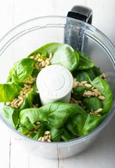 spinach leaves and seeds in a food processor