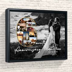 an anniversary photo with the number five on it is mounted to a brick wall in front of a black frame