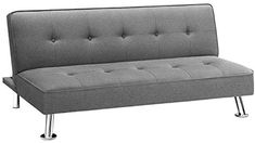 a gray couch sitting on top of a metal frame