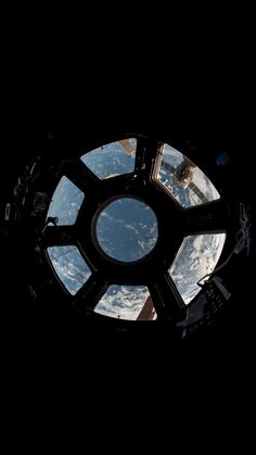 the earth seen through a window in space