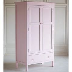 a pink armoire with two doors on one side and drawers on the other end