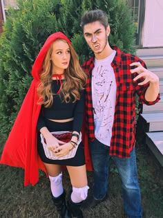 a man and woman in costumes posing for a photo on their cell phone with the caption