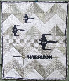 a quilted wall hanging with three fighter jets on it's side and the words harrison written in black