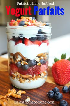 yogurt parfaits in a jar with berries and nuts on the side