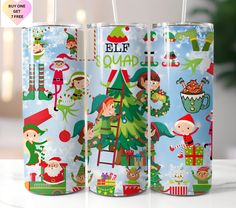 three christmas themed cans are sitting on a white surface with the words elf squad printed on them