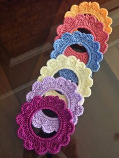 there are many crocheted circles on the table