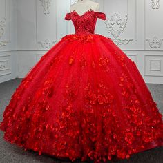 Make a bold and beautiful statement on your quinceanera with the Sweet Valentine Red Quinceanera Dress. The dress features a stunning ball gown silhouette crafted from layers of delicate tulle fabric that provide volume and movement, giving you a dreamy and ethereal look. The striking red color symbolizes love and celebration, making it the perfect choice for your special day. The off-the-shoulder neckline is the epitome of romance, beautifully framing the shoulders and collarbones, while the sl