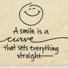 a smile is a curve that sets everything straight rubber stamp with handwritten text on it